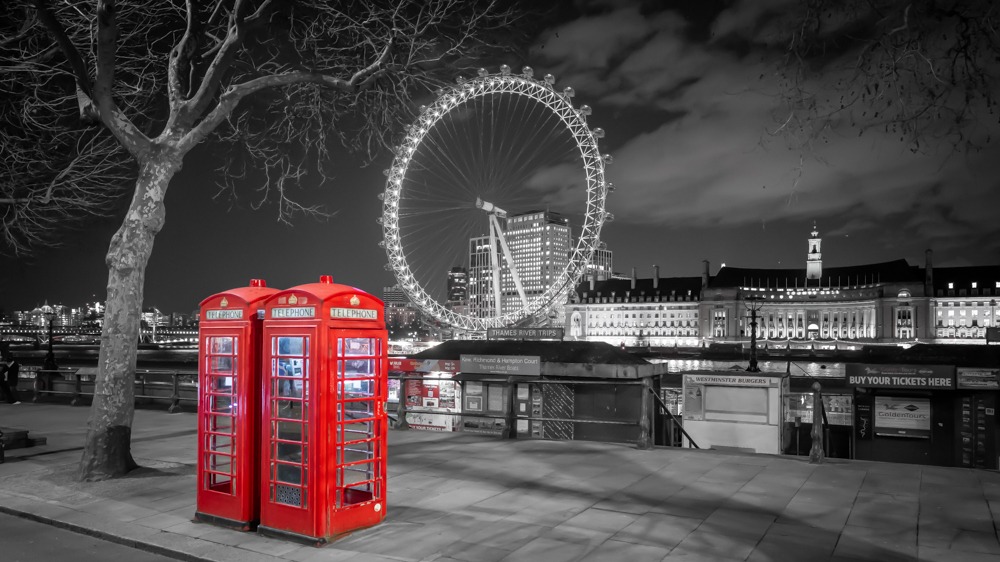 Red telephone boxes and the London Eye at night Red telephone boxes and the London Eye at night